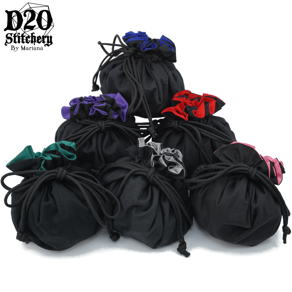 6 Epic dice bags with black exterior fabric and each with a different color of lining fabric tied with black paracord.