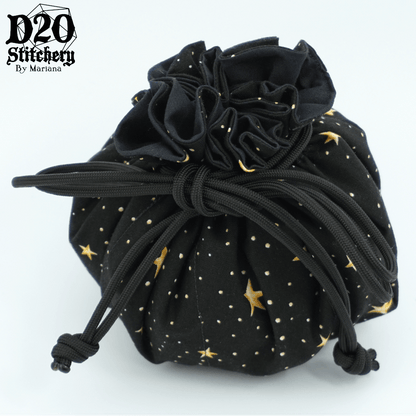 Tied epic dice bag with 5 point yellow stars and white/yellow dots on the background